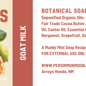 Soap bar label with cedar, citrus, and goat milk ingredients on a red background